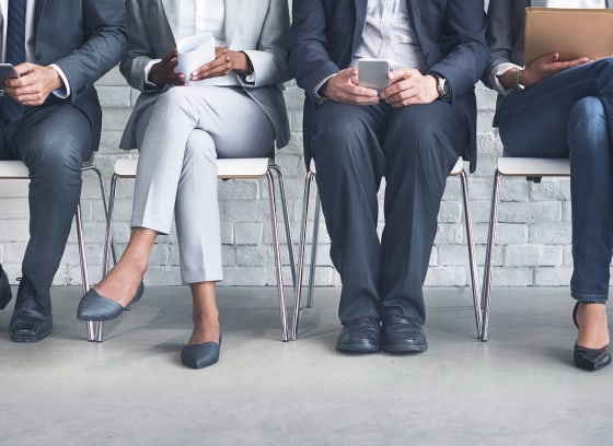 people sitting in business suits