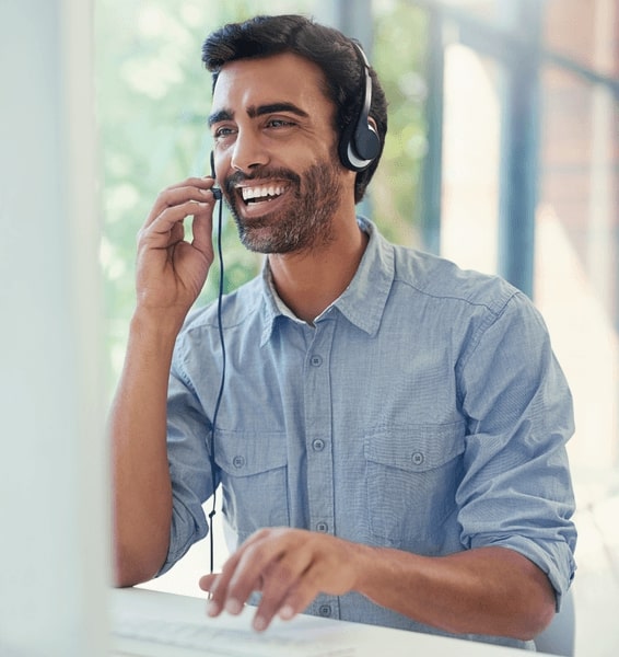 A man smiling while having a call